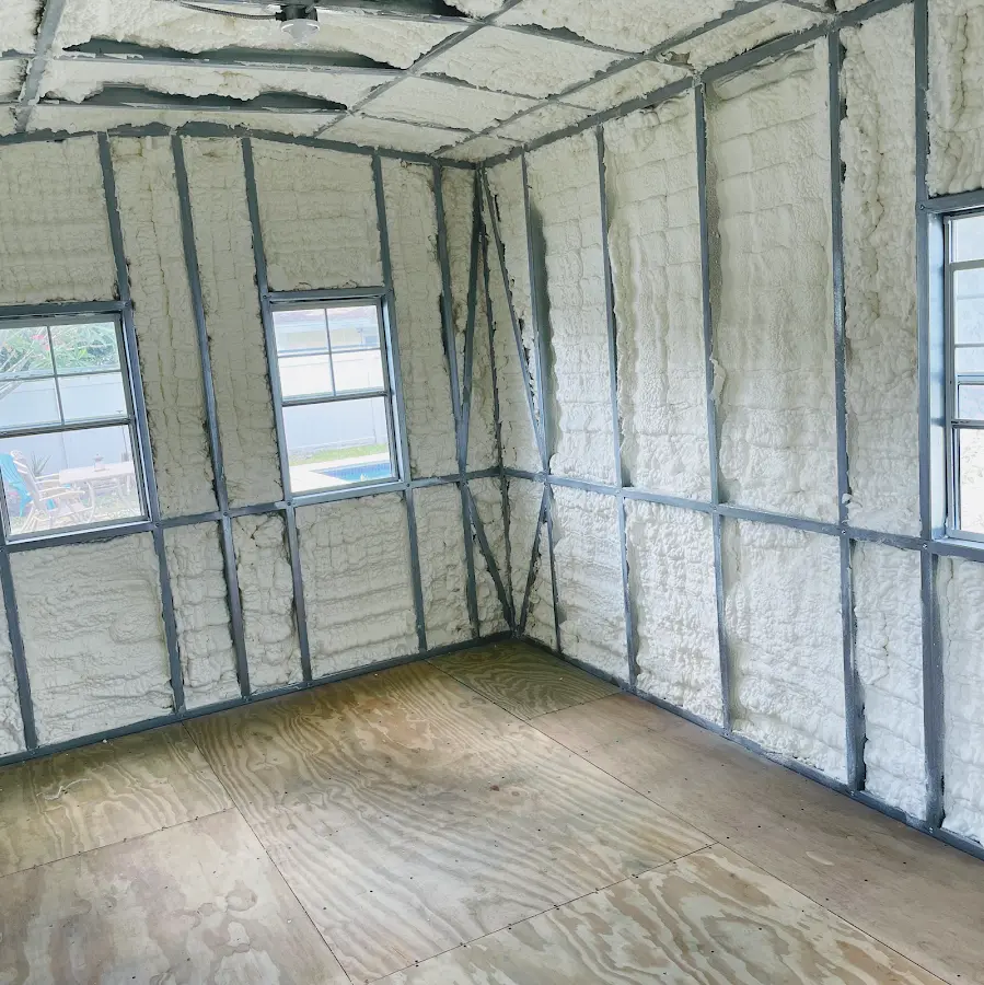 Closed-cell spray foam insulation applied to wall cavities in a residential project in Globe